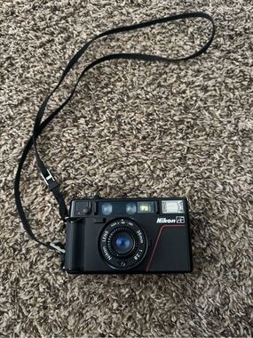 Nikon Black 35mm Film Camera with Built-In Flash